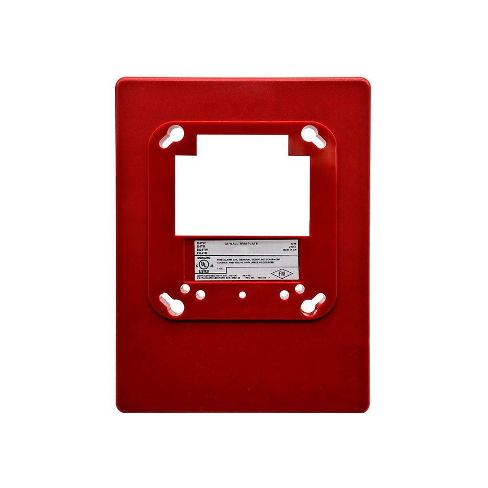 Edwards G4TR fire alarm trim plate mounted on wall, with a sleek, rectangular design and white finish.