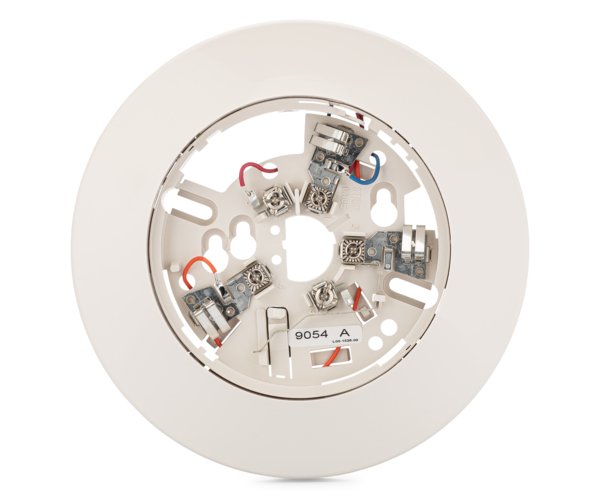 System Sensor B112LP fire alarm relay base mounted on ceiling, showing electrical contacts and mounting hardware.