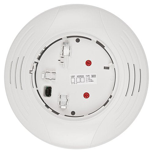 System Sensor B200SR-WH intelligent sounder base for fire alarms, mounted on a ceiling with wiring visible.
