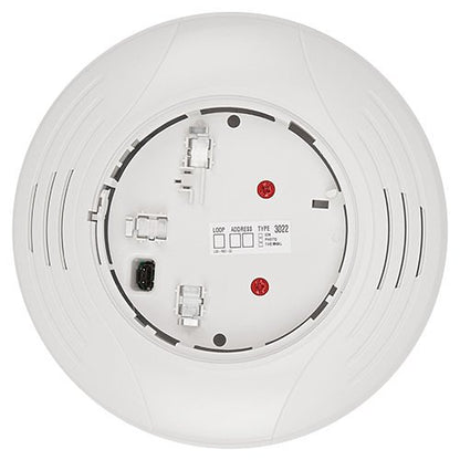 System Sensor B200SR-WH intelligent sounder base for fire alarms, mounted on a ceiling with wiring visible.