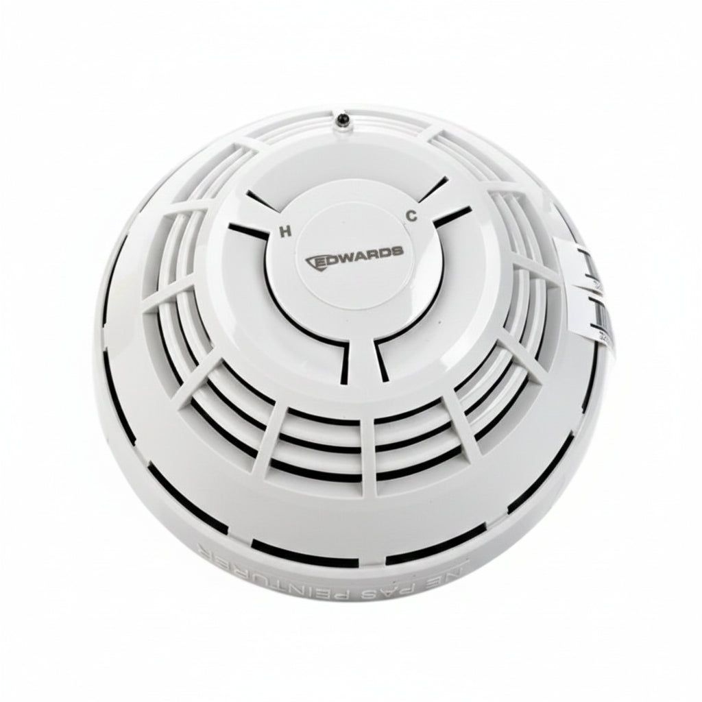 Edwards SIGA-HCD multisensor heat and carbon monoxide detector with digital display, mounted on a wall for home safety.