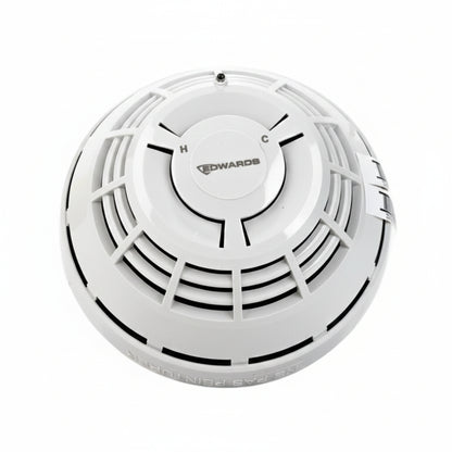 Edwards SIGA-HCD multisensor heat and carbon monoxide detector with digital display, mounted on a wall for home safety.