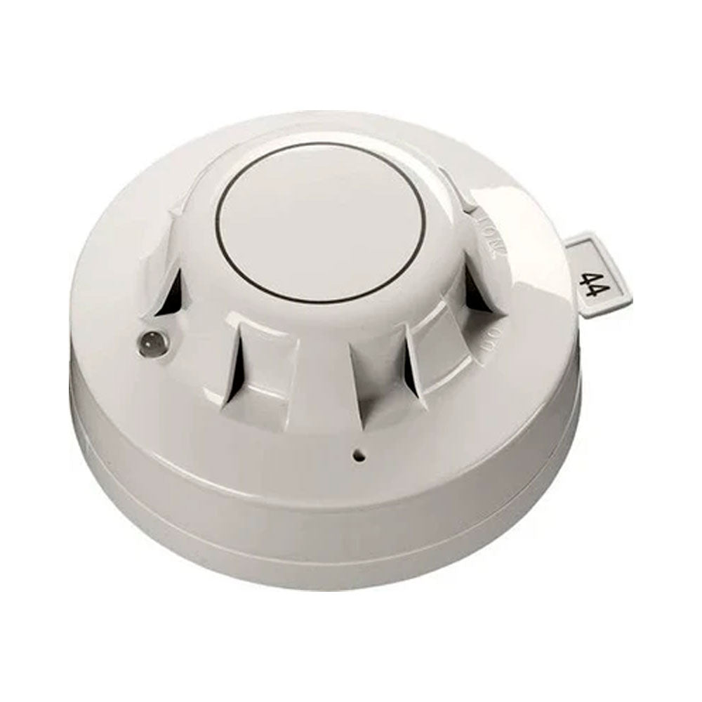 Apollo 55000-600APO XP95 optical smoke detector mounted on ceiling, part of smoke detection system for fire safety.