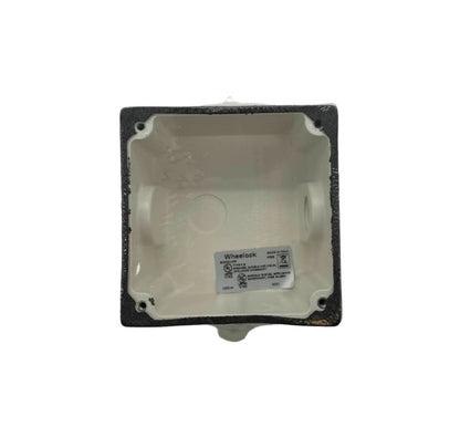 Eaton Wheelock WBB-W weather-resistant back box for fire alarms, durable metal enclosure with mounting features.