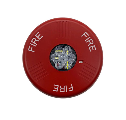 Eaton Wheelock ELSTRC fire alarm strobe light mounted on wall, part of Eaton Wheelock fire alarm system, with clear lens and mounting bracket