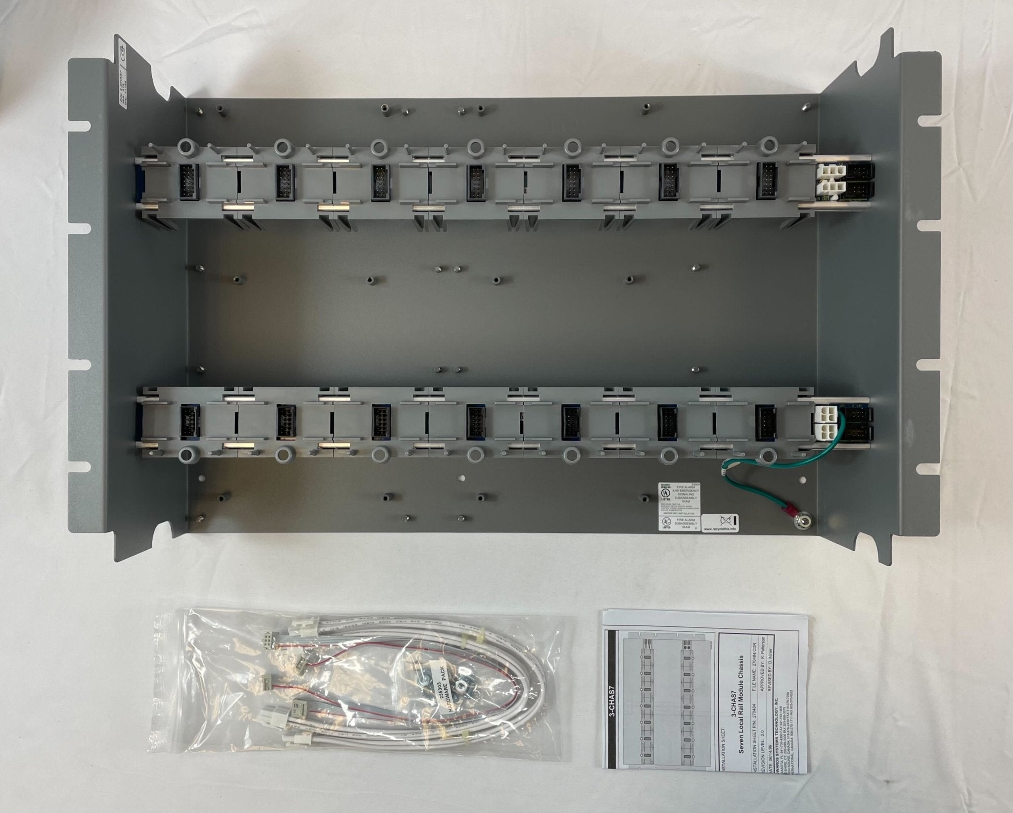 Edwards 3-CHAS7 fire alarm chassis assembly with circuit board and components, used for Edwards fire alarm systems.