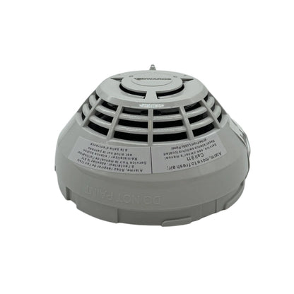 Edwards SIGA-OSCD smoke and carbon monoxide detector mounted on a ceiling, safety device by Edwards for home or office use.