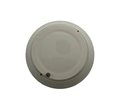Farenhyt IDP-FIRE-CO-IV fire and carbon monoxide detector mounted on wall, black rectangular device with indicator lights.
