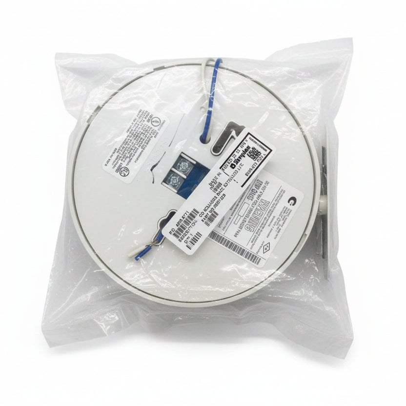 Simplex 4098-9771 fire alarm base with sounder, part of Simplex fire alarm system, mounted on wall.