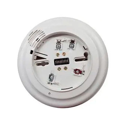 Simplex 4098-9794 fire alarm sensor and sounder base installed on ceiling, part of Simplex fire alarm system.