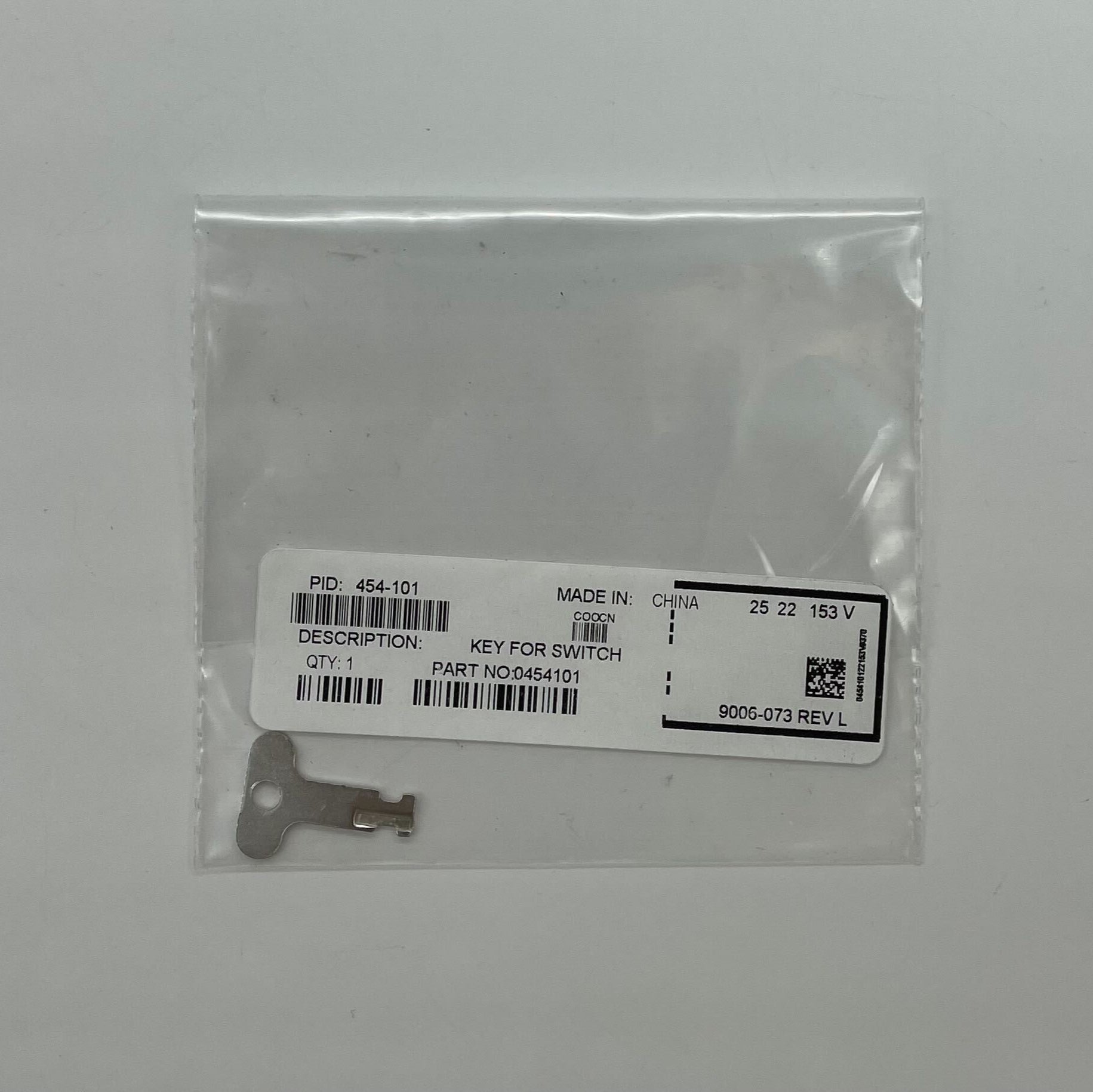 Simplex 454-101 fire alarm key with black plastic handle and metal key blade, designed for Simplex fire alarm systems.