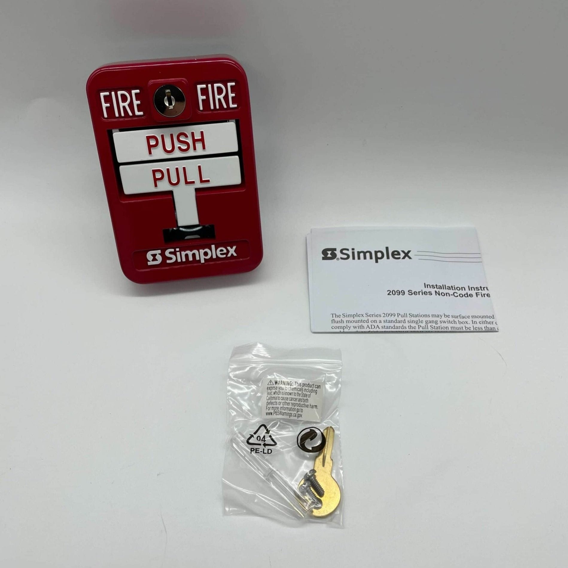 Simplex 2099-9139 manual fire alarm pull station with red handle and clear labeling, designed for emergency fire alerts.