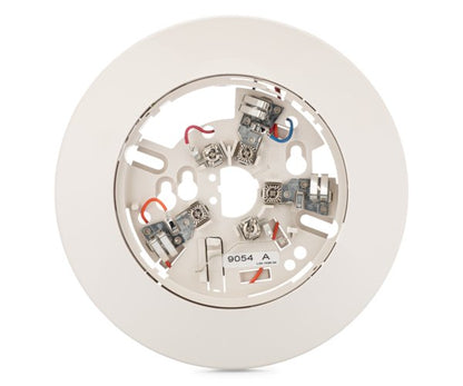 System Sensor B112LP fire alarm relay base mounted on ceiling, showing electrical contacts and mounting hardware.