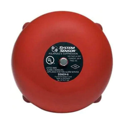 System Sensor SSM24-6 fire alarm bell, 6-24V DC, mounted on wall, with metal housing and wiring for fire safety notification.