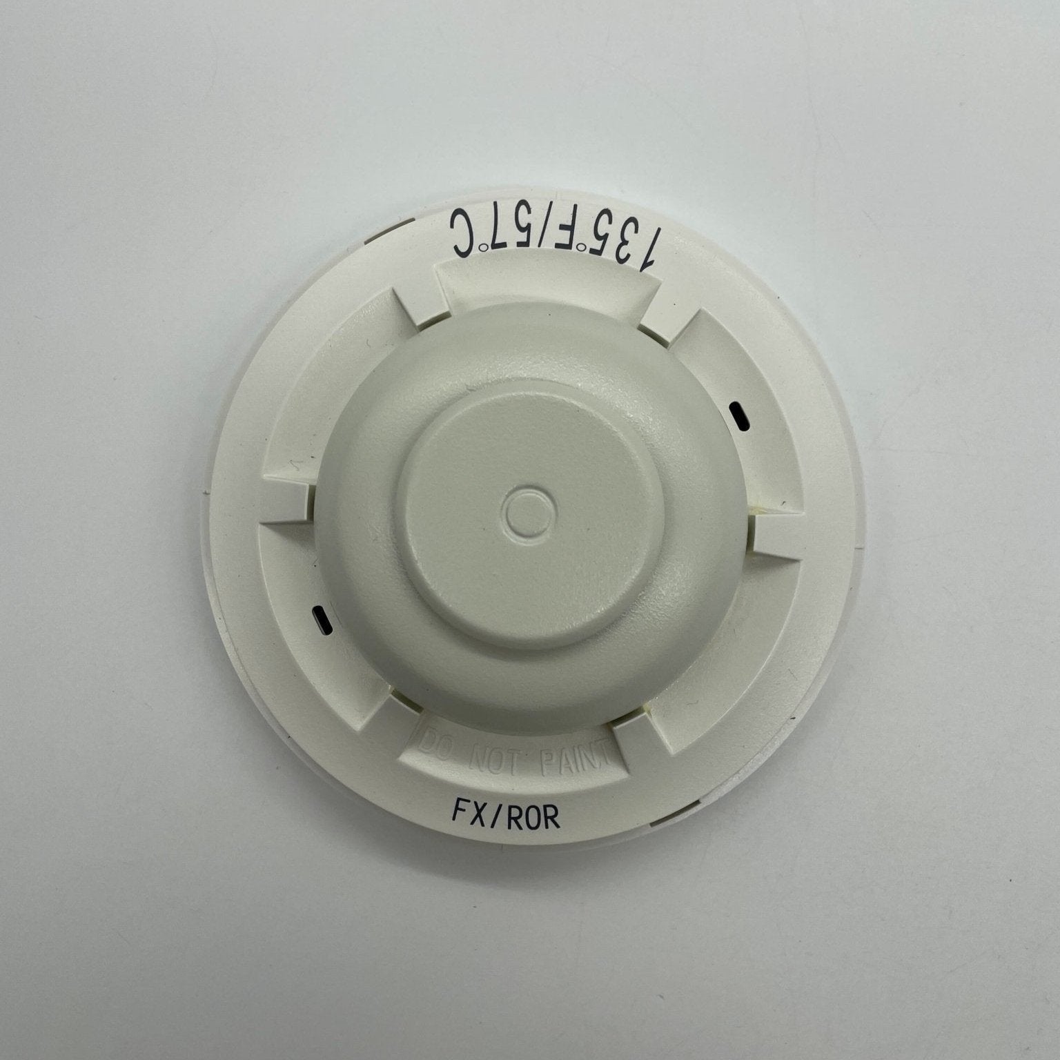 System Sensor 5621 fire alarm heat detector showing a round, white device designed for temperature detection in fire safety systems.