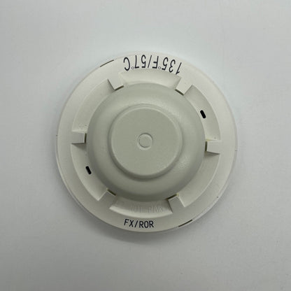System Sensor 5621 fire alarm heat detector showing a round, white device designed for temperature detection in fire safety systems.